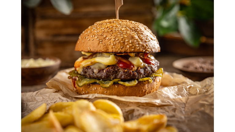 Tasty grilled home made burger,Close-up of burger on serving board