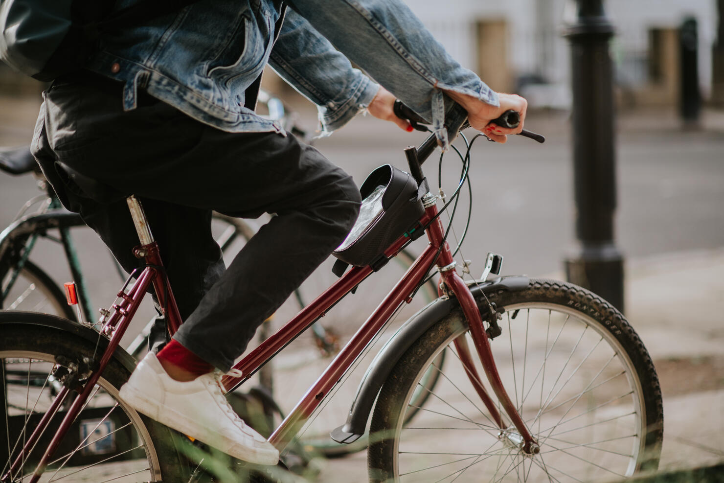 A man commutes to work in a UK city on a manual pedal bike