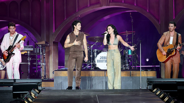 Watch Jonas Brothers Bring Out Demi Lovato For Surprise 'Camp Rock' Reunion