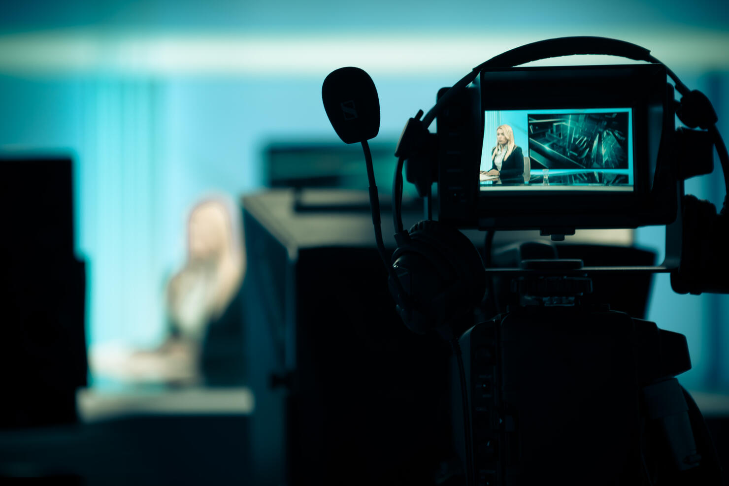.Recording at TV studio with television anchorwoman