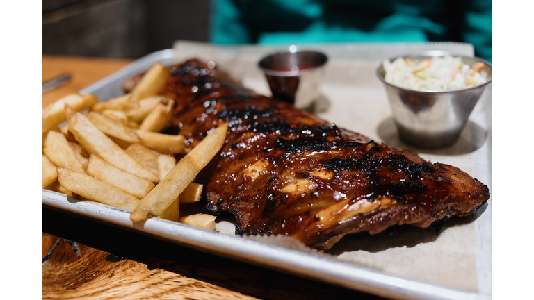 BBQ Baby Back Ribs, French Fries, and Coleslaw at Restaurant