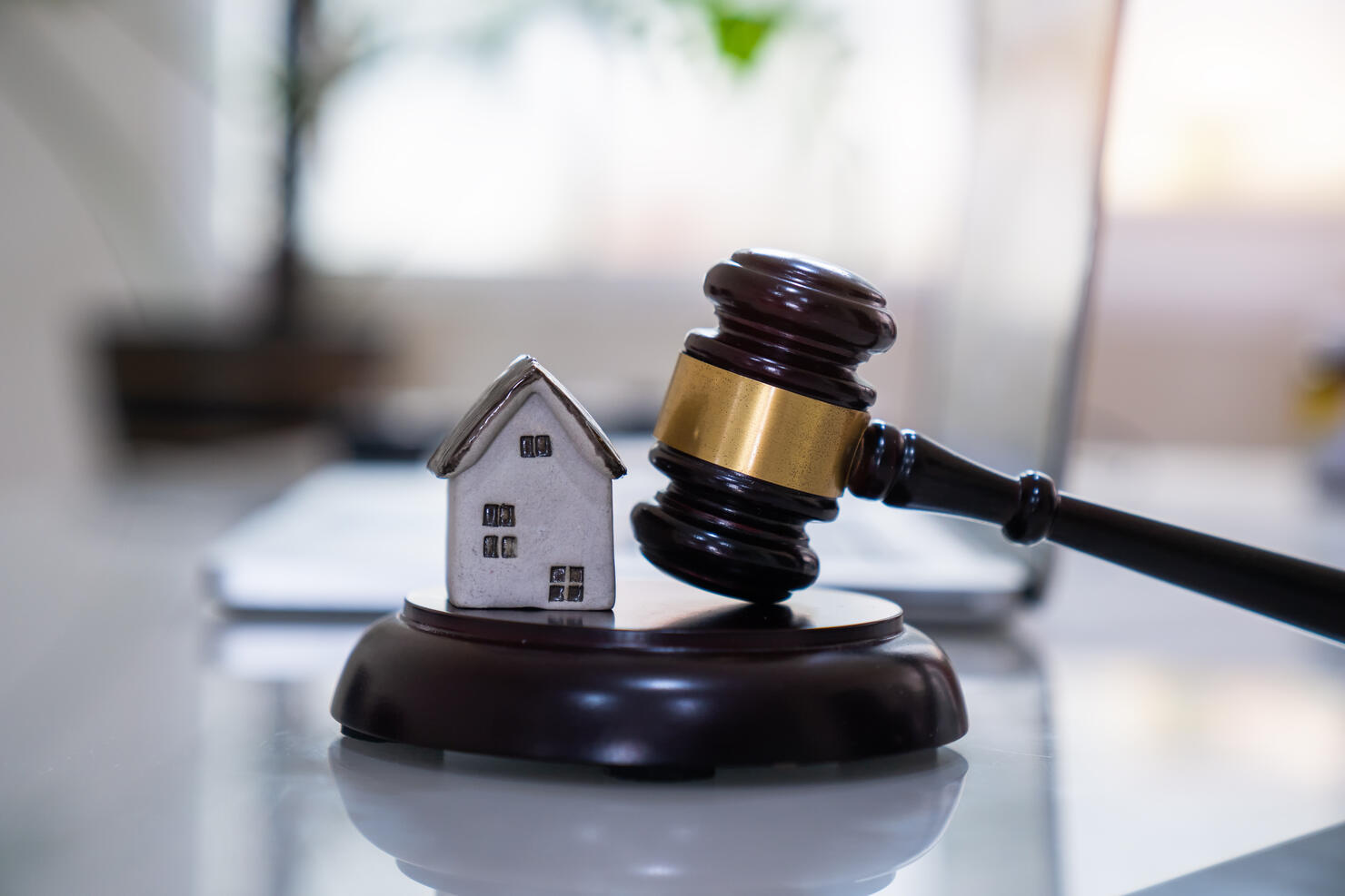 House with gavel. Real estate law and house auction concept.