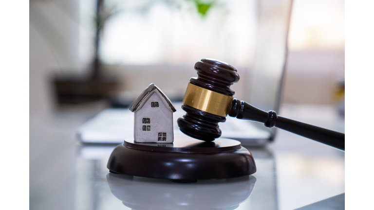 House with gavel. Real estate law and house auction concept.