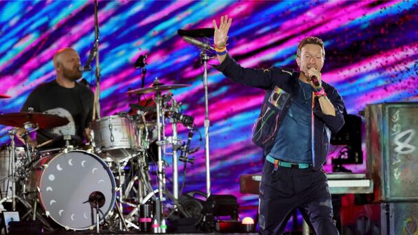 Chris Martin Pokes Fun At 'Scandal' While Helping Fan Propose At Concert
