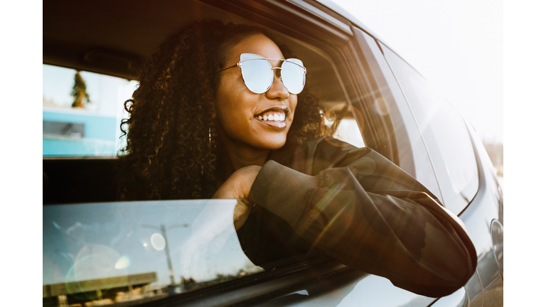 Group of Young Adults Having Fun Riding in Car