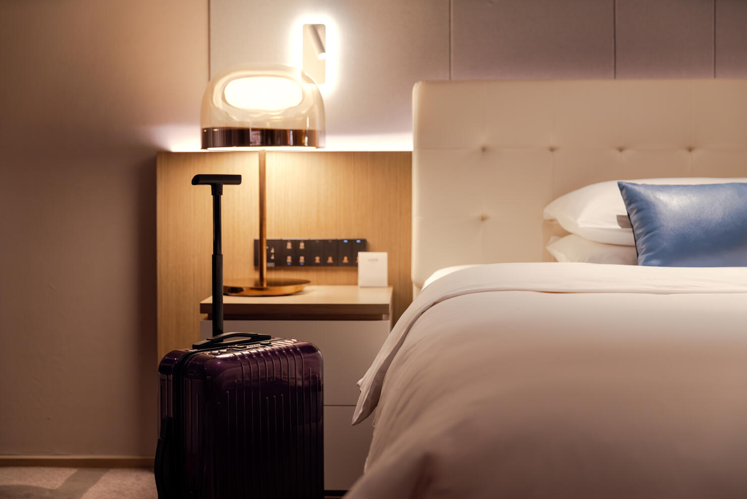 Clean and tidy hotel bedrooms and suitcases.