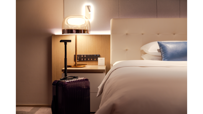 Clean and tidy hotel bedrooms and suitcases.