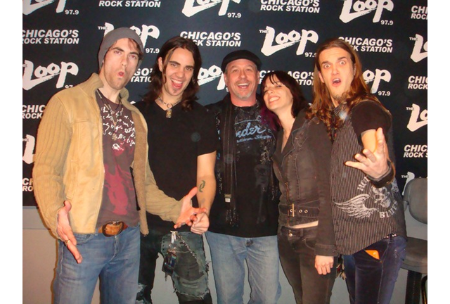 photo of patrick capone with the band Halestorm when they visited the WLUP Loop studios on their very first tour