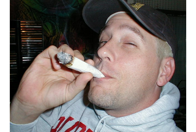 photo of Bob Gnarly smoking a fat joint in the Killer Kona Buds recording studio back in 1997
