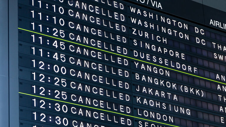 Airport Flight Information Board With Cancelled Flights