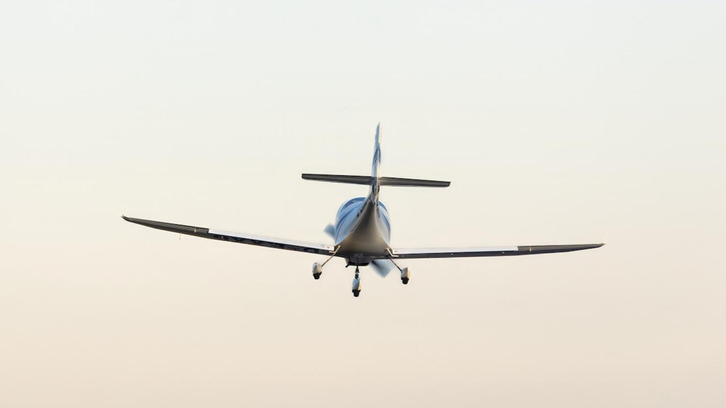 small plane in the air. concept in articles and advertising materials related to aviation, air travel, private jets and flight school.