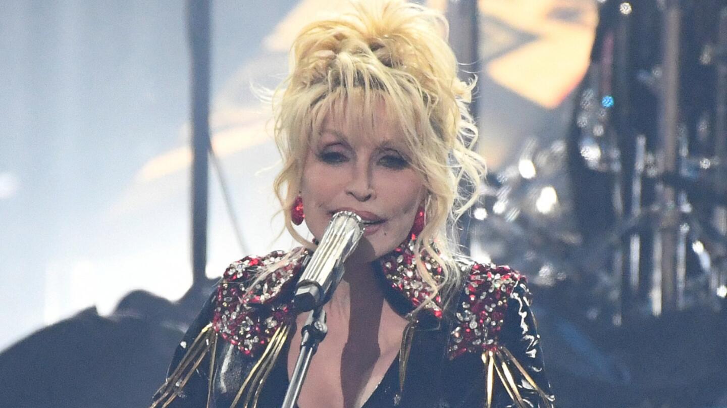 Dolly Parton Performs Timeless Hit With Iconic Artist In Throwback Clip