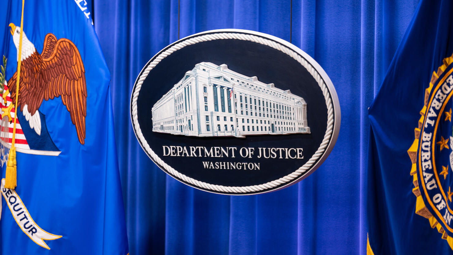 Department Of Justice And International Law Enforcement Hold News Conference