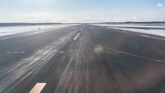 Plane Skids On Icy Runway Amid Post-Thanksgiving Snow Storm