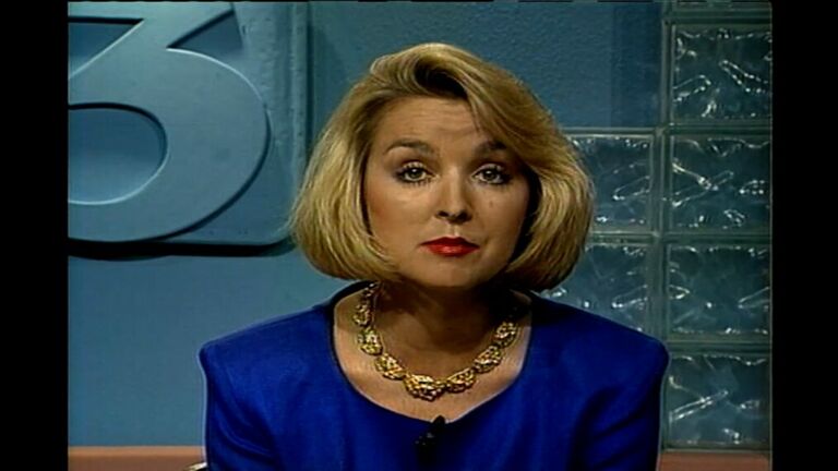Jodi Huisentruit in blue blazer at the anchor desk for KIMT in Mason City.