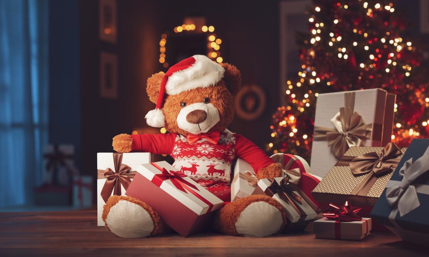 Many Christmas gifts and cute teddy bear