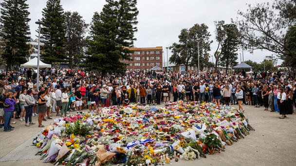 Bondi Beach Shooting Suspect Charged After Waking From Coma