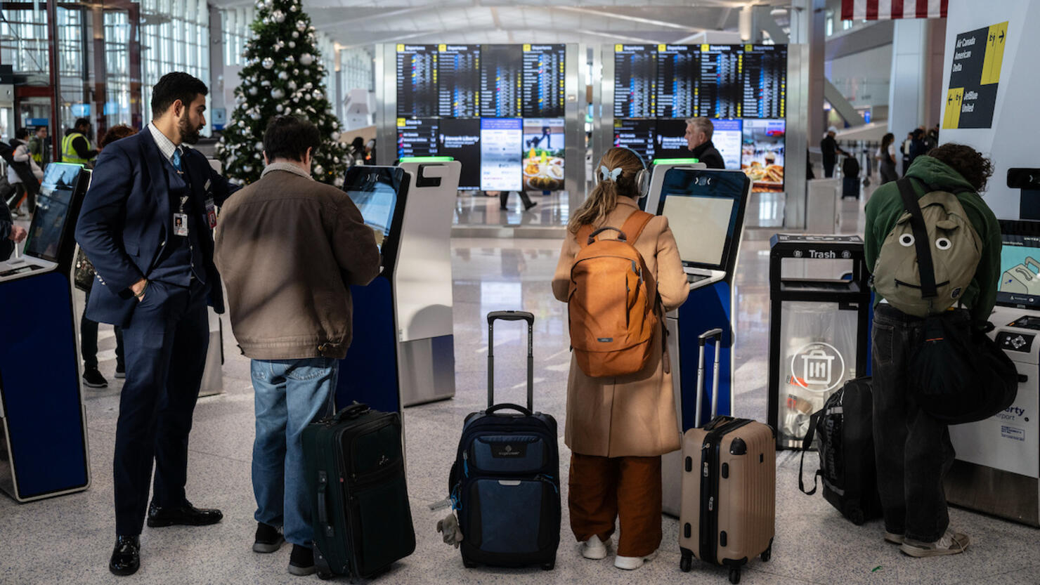 Travelers At Newark Airport Ahead Of Thanksgiving Holiday