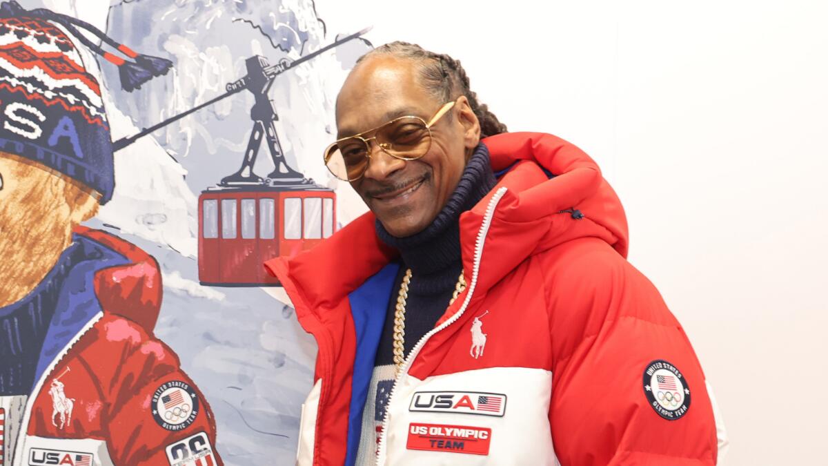 Snoop Dogg Carries Torch During Winter Games Opening Ceremony In Italy