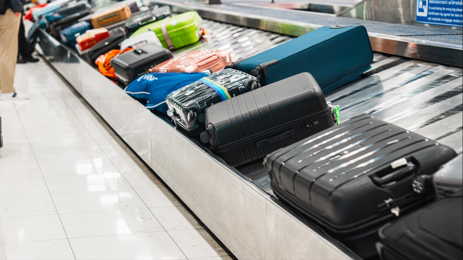 In the international airport, a conveyor belt is used to move luggage or cases.
