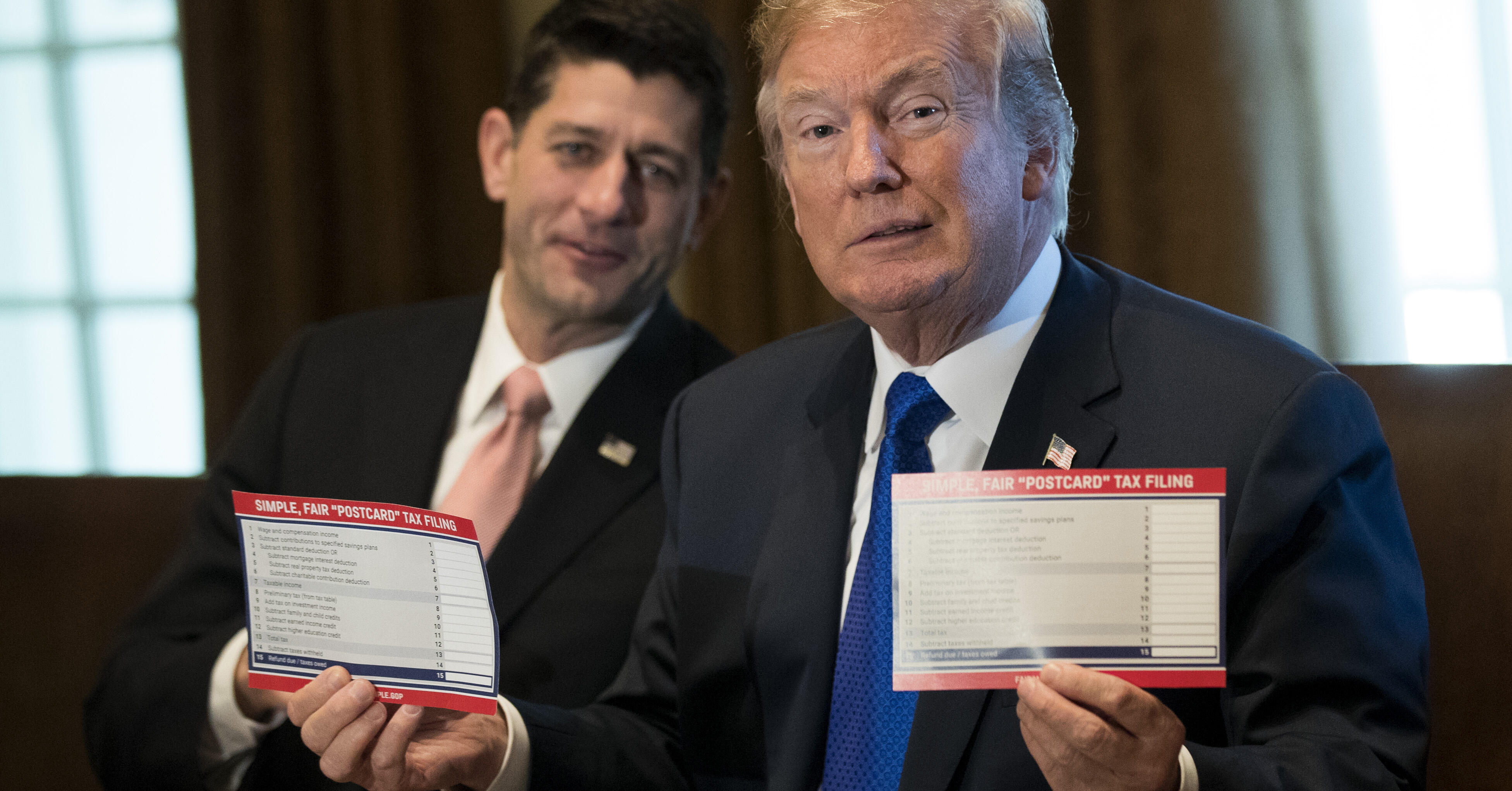 Speaker of the House Paul Ryan looks on as President Donald Trump speaks about tax reform legislation in the Cabinet Room at the White House, November 2, 2017 in Washington, DC. On Thursday, Republican lawmakers unveiled their plans for a massive rewrite of the U.S. tax code.