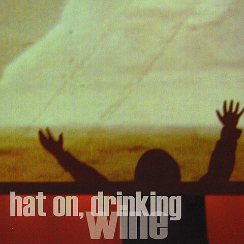 Hat on, Drinking Wine