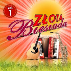 Stoi Andzia w ogrodzie