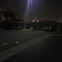 Under a Light Pole in the Wendy's/Black Angus Parking Lot
