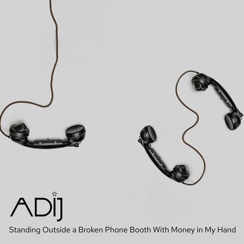 Standing Outside a Broken Phone Booth With Money in My Hand