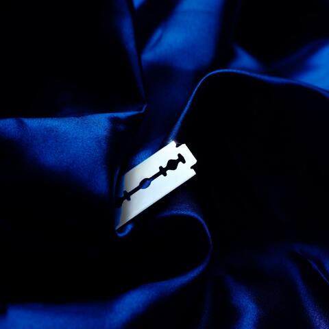 A Blade Wrapped In Silk