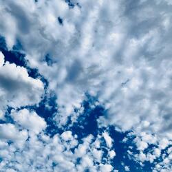 grey clouds in a blue sky
