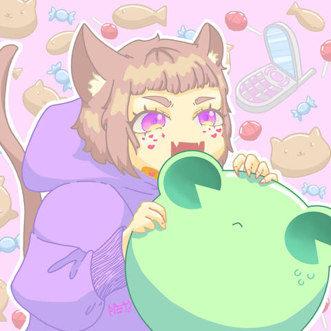 The cat plays with the frog