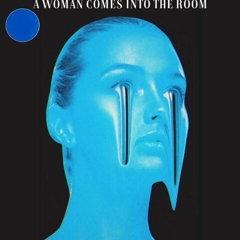 A WOMAN COMES INTO THE ROOM