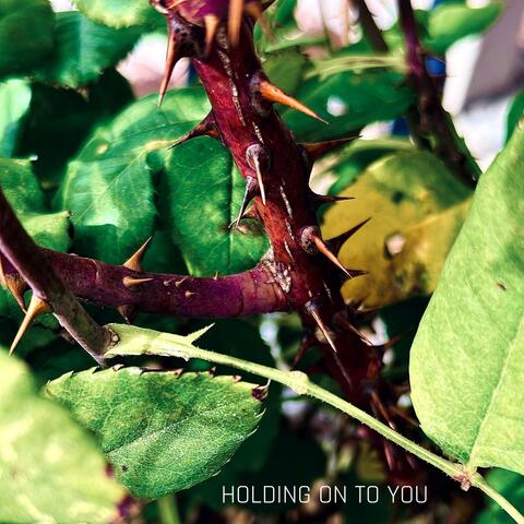 HOLDING ON TO YOU