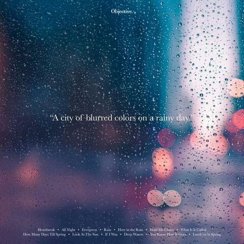 A city of blurred colors on a rainy day.