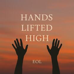 Hands lifted high