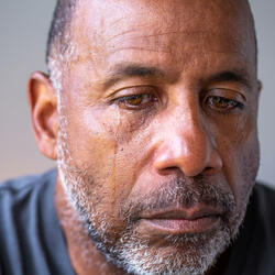 The sun sets, over the Statue of Liberty