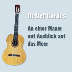 An einer Mauer mit Ausblick auf das Meer