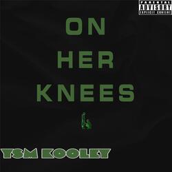 On her knees