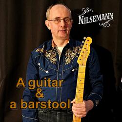 A guitar and a barstool