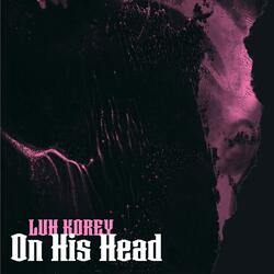 On his head