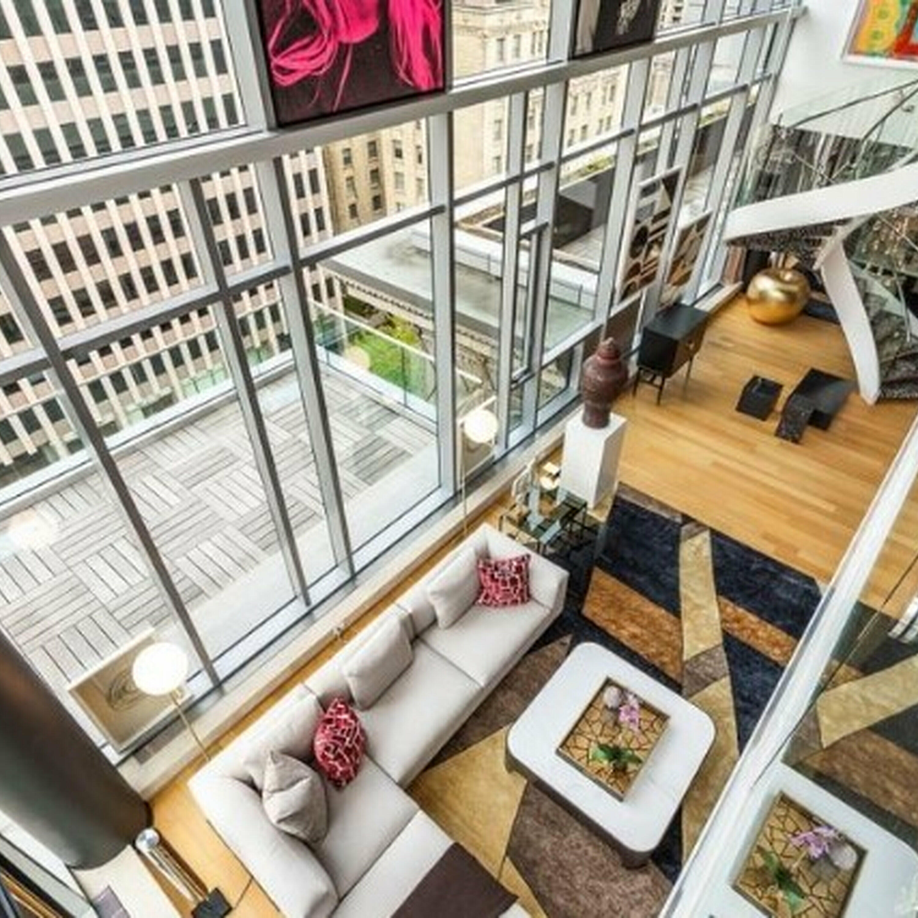 How can building luxury condos help low-income renters?