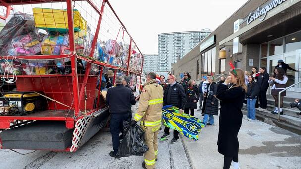 Ottawa firefighters deliver thousands of toys to Toy Mountain for sorting